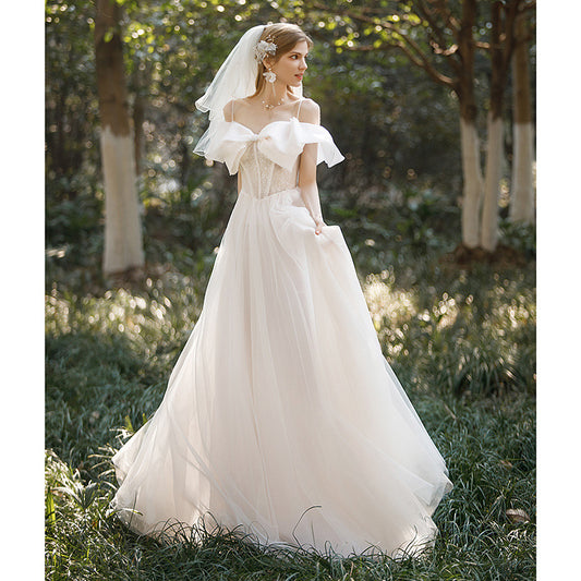 light wedding dress 2025 new bride one-word shoulder suspenders small bow temperament presiding over dress trailing