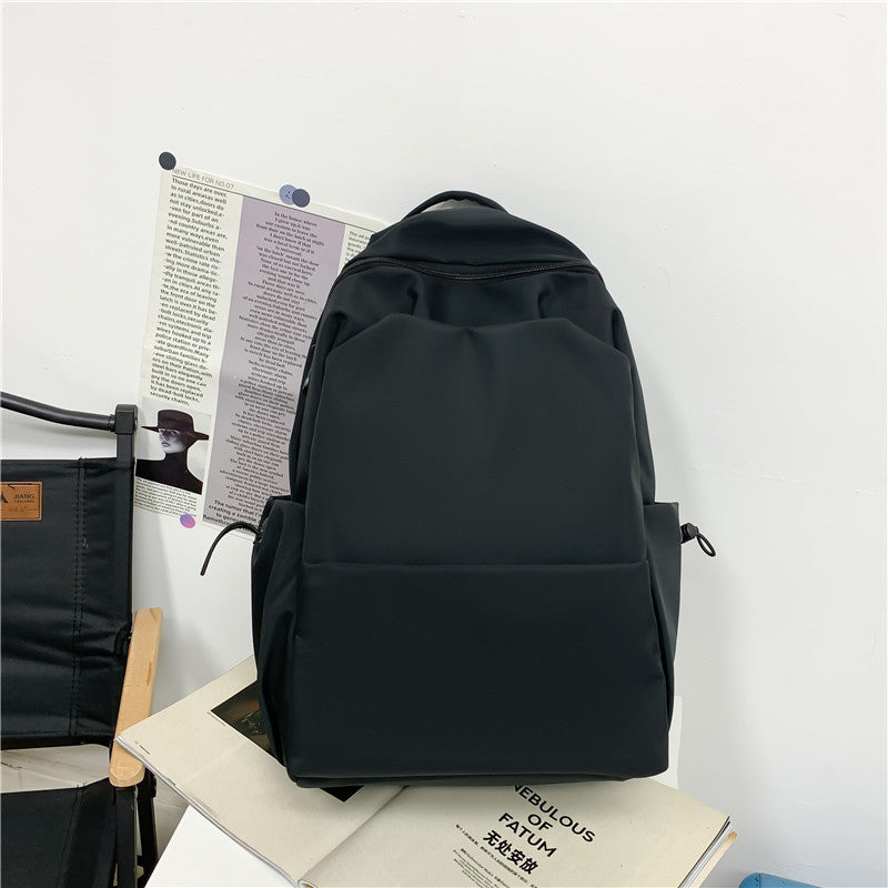 2025 Campus Japanese backpack versatile male and female junior high school college student schoolbag solid color casual large capacity travel backpack