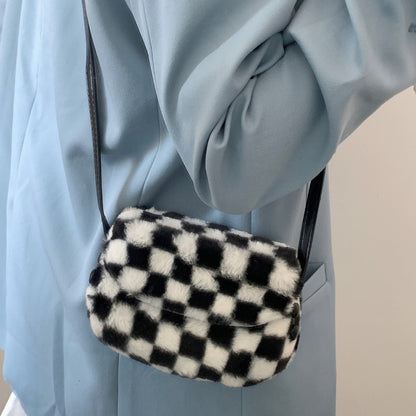 FLOWERSVERSE 2025 Autumn and winter new furry saddle bag crossbody small bag women  Korean retro black and white plaid furry bag
