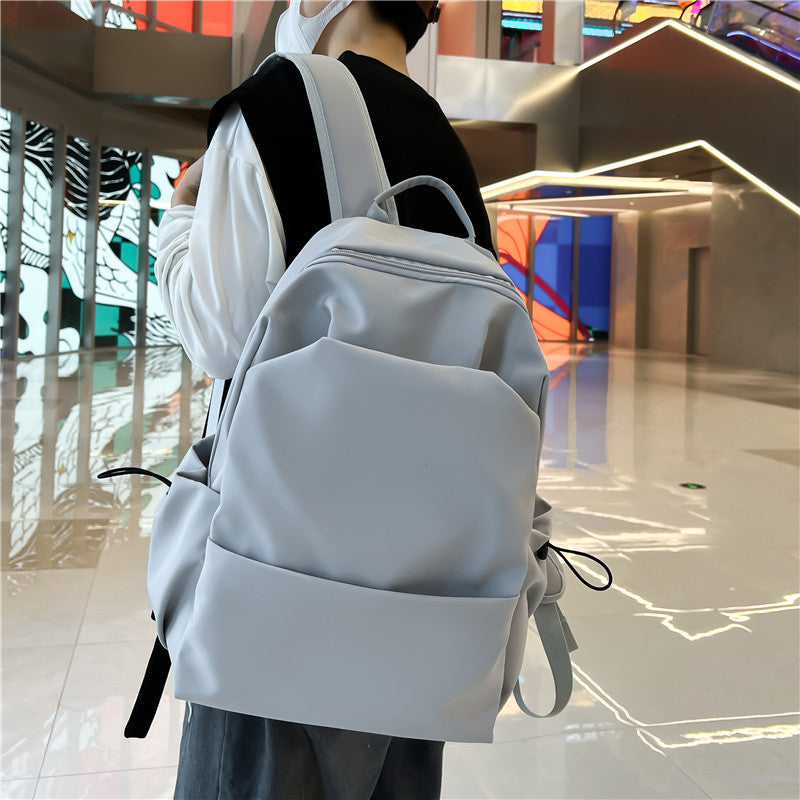 2025 Campus Japanese backpack versatile male and female junior high school college student schoolbag solid color casual large capacity travel backpack