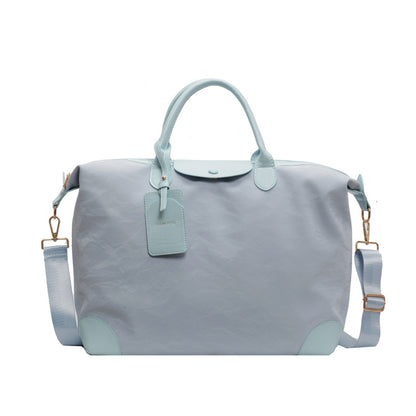 2025 New large-capacity portable travel bag, women's light sports fitness bag, outdoor leisure travel bag, duffel bag.