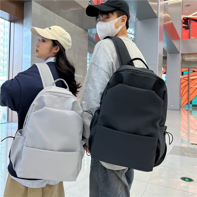 2025 Campus Japanese backpack versatile male and female junior high school college student schoolbag solid color casual large capacity travel backpack