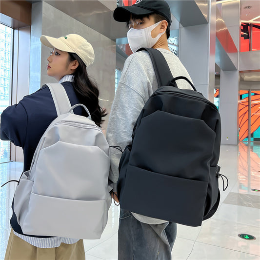 2025 Campus Japanese backpack versatile male and female junior high school college student schoolbag solid color casual large capacity travel backpack