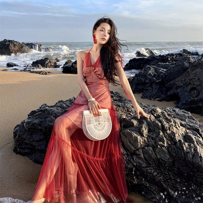 2025 Sanya seaside vacation dress women's design sense niche red backless mesh splicing suspender neck long skirt