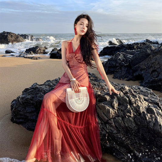 2025 Sanya seaside vacation dress women's design sense niche red backless mesh splicing suspender neck long skirt
