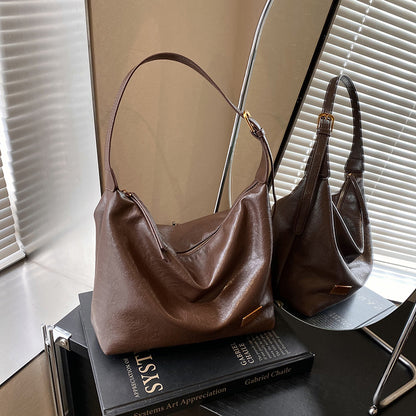 FLOWERSVERSE 2025 Autumn and winter new retro oily leather PU women's bag simple fashion iron brand small square brand armpit bag temperament commuter shoulder bag