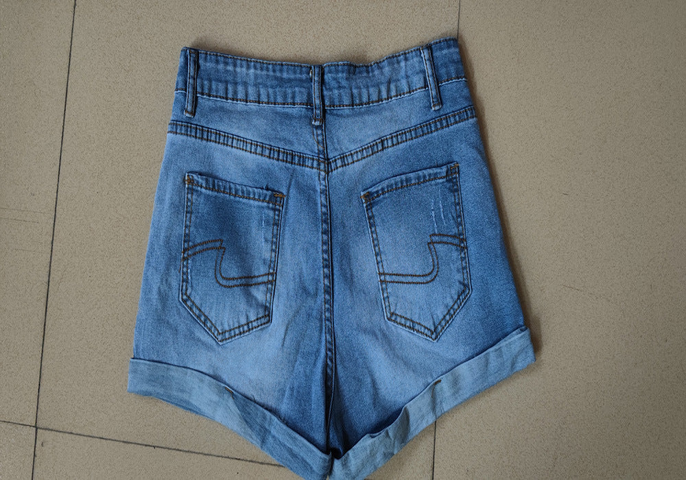 Popular trade elastic hole flanged denim shorts women