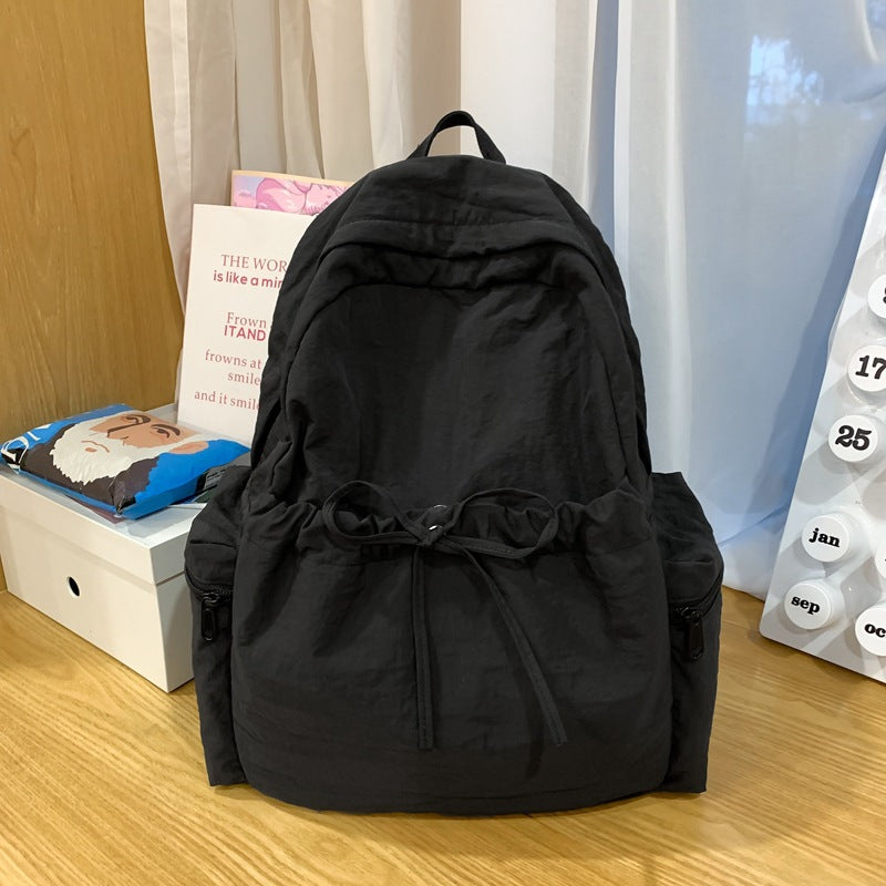 2025 School bag female college student cute bow simple junior high school student backpack female high school student large capacity backpack casual