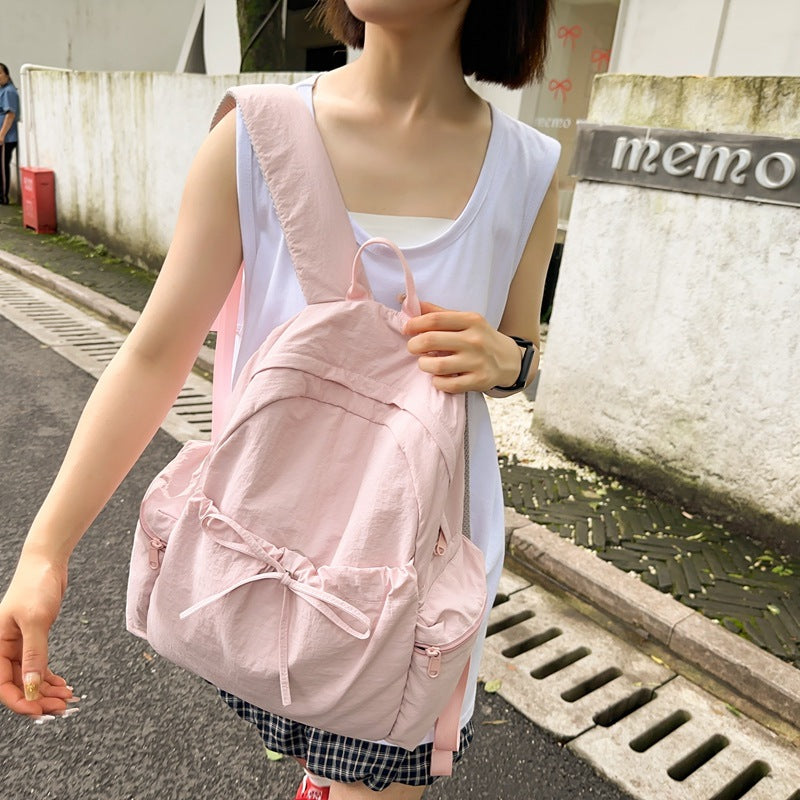 2025 School bag female college student cute bow simple junior high school student backpack female high school student large capacity backpack casual