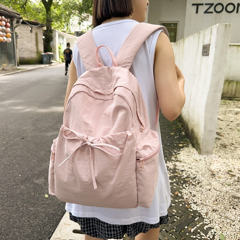 2025 School bag female college student cute bow simple junior high school student backpack female high school student large capacity backpack casual