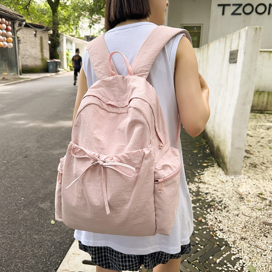 2025 School bag female college student cute bow simple junior high school student backpack female high school student large capacity backpack casual