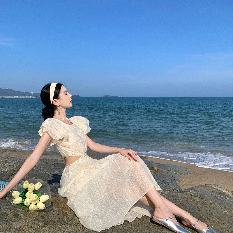 2025 Niche design sense hollow waist seaside vacation flying sleeve dress women's summer Sanya travel photo dress