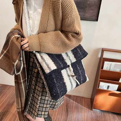 FLOWERSVERSE 2025 popular autumn and winter new striped woolen shoulder bag fashion lamb wool folding horn buckle Korean version fashion messenger bag