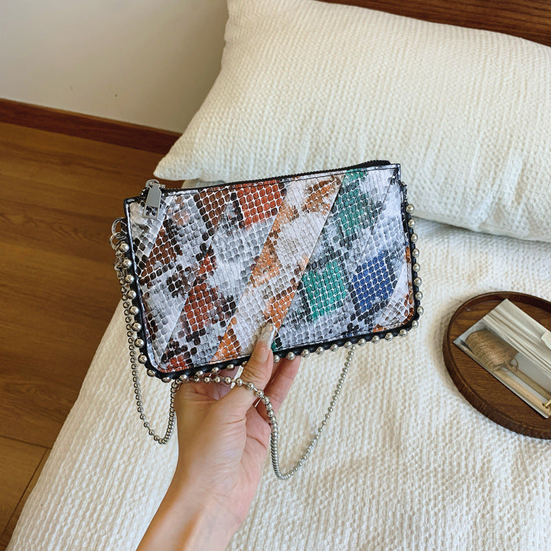 FLOWERSVERSE 2025 Cross-border wind bag women's new snake pattern splicing contrasting color envelope bag 2025 trendy Popular style women's bead chain shoulder bag