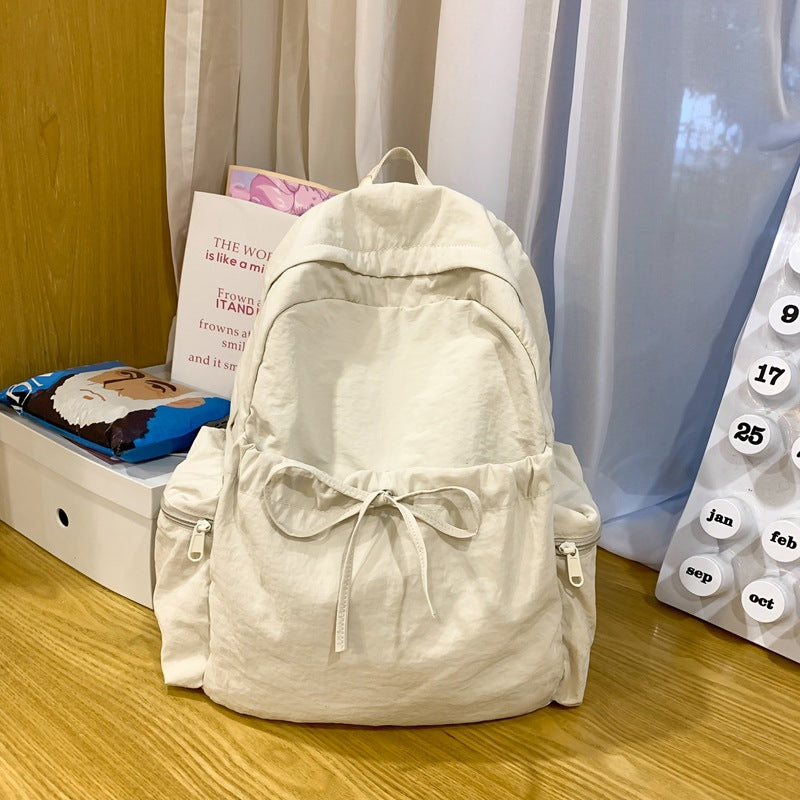2025 School bag female college student cute bow simple junior high school student backpack female high school student large capacity backpack casual