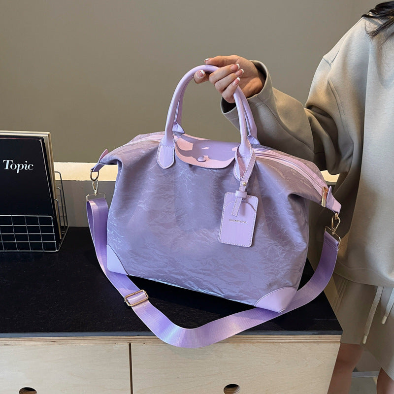 2025 New large-capacity portable travel bag, women's light sports fitness bag, outdoor leisure travel bag, duffel bag.