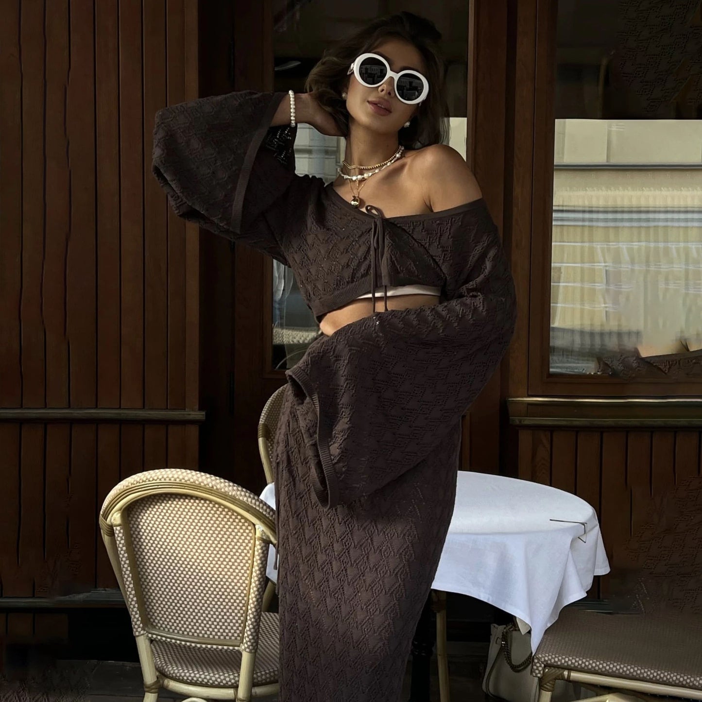 Autumn wear solid color knitted hollow suit women's high sense royal sister horn sleeve top pleated split skirt