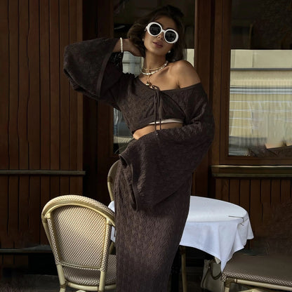 Autumn wear solid color knitted hollow suit women's high sense royal sister horn sleeve top pleated split skirt