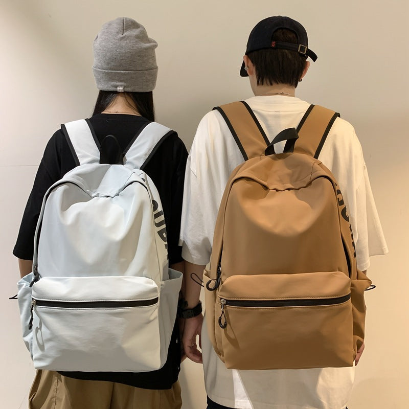 2025 popular lightweight solid color schoolbag female college student travel fashion high school student large capacity backpack middle school student backpack