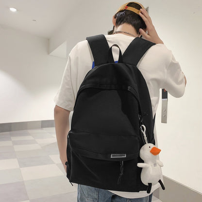 2025 Couple backpack simple large capacity travel backpack female leisure Japanese junior high school student high school student schoolbag male