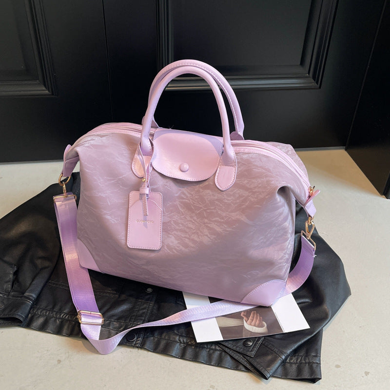 2025 New large-capacity portable travel bag, women's light sports fitness bag, outdoor leisure travel bag, duffel bag.