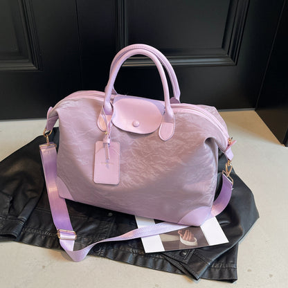 2025 New large-capacity portable travel bag, women's light sports fitness bag, outdoor leisure travel bag, duffel bag.