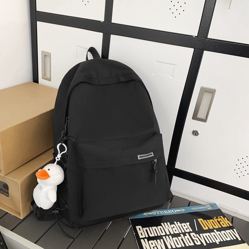 2025 Couple backpack simple large capacity travel backpack female leisure Japanese junior high school student high school student schoolbag male