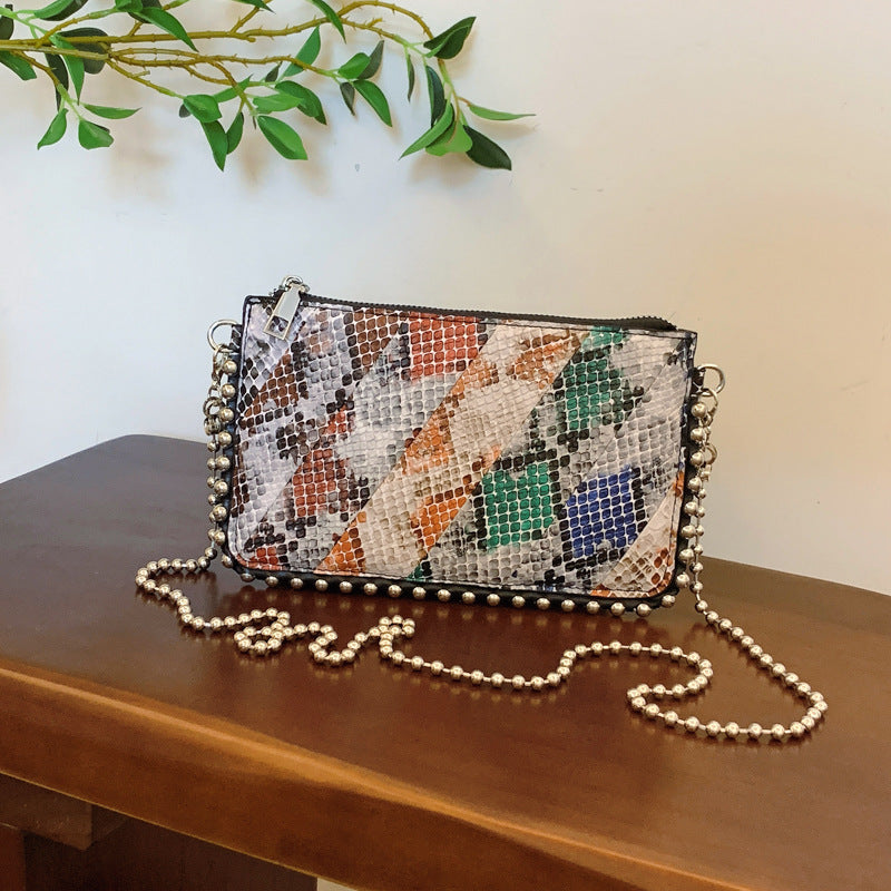 FLOWERSVERSE 2025 Cross-border wind bag women's new snake pattern splicing contrasting color envelope bag 2025 trendy Popular style women's bead chain shoulder bag