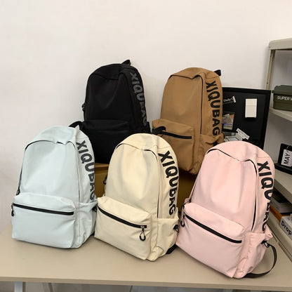 2025 popular lightweight solid color schoolbag female college student travel fashion high school student large capacity backpack middle school student backpack