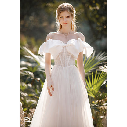 light wedding dress 2025 new bride one-word shoulder suspenders small bow temperament presiding over dress trailing