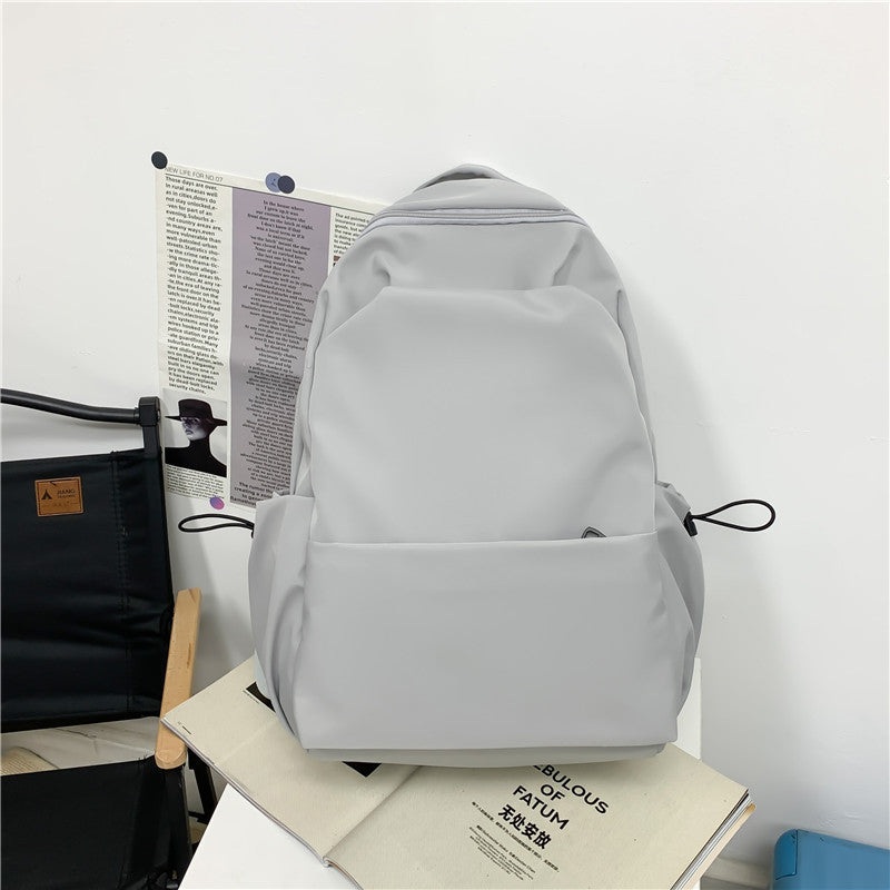 2025 Campus Japanese backpack versatile male and female junior high school college student schoolbag solid color casual large capacity travel backpack