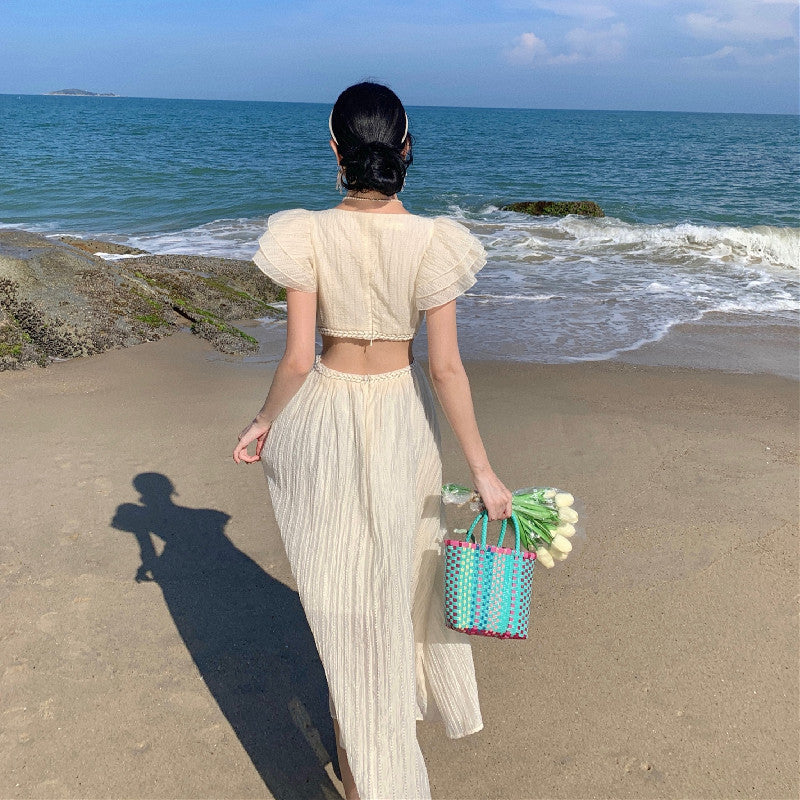 2025 Niche design sense hollow waist seaside vacation flying sleeve dress women's summer Sanya travel photo dress