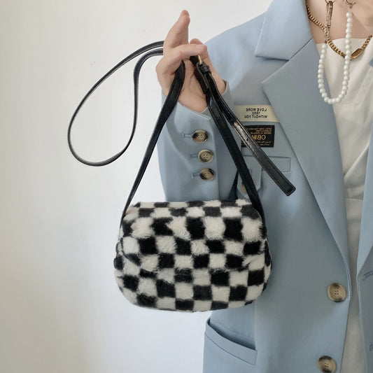 FLOWERSVERSE 2025 Autumn and winter new furry saddle bag crossbody small bag women  Korean retro black and white plaid furry bag