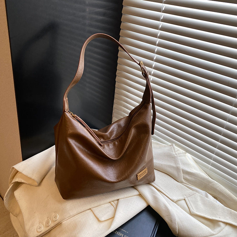 FLOWERSVERSE 2025 Autumn and winter new retro oily leather PU women's bag simple fashion iron brand small square brand armpit bag temperament commuter shoulder bag