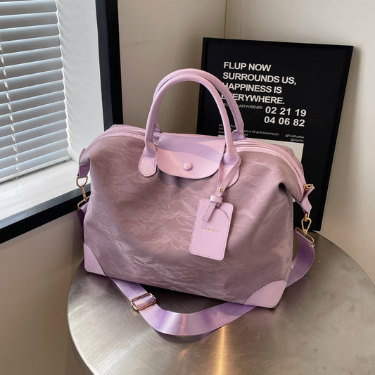 2025 New large-capacity portable travel bag, women's light sports fitness bag, outdoor leisure travel bag, duffel bag.