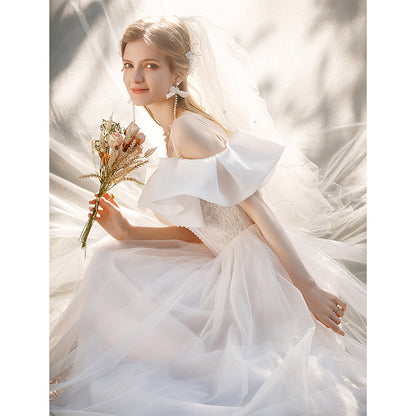 light wedding dress 2025 new bride one-word shoulder suspenders small bow temperament presiding over dress trailing