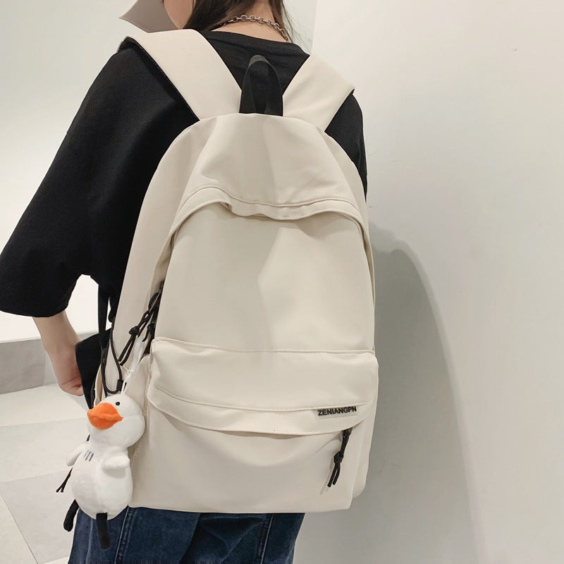 2025 Couple backpack simple large capacity travel backpack female leisure Japanese junior high school student high school student schoolbag male
