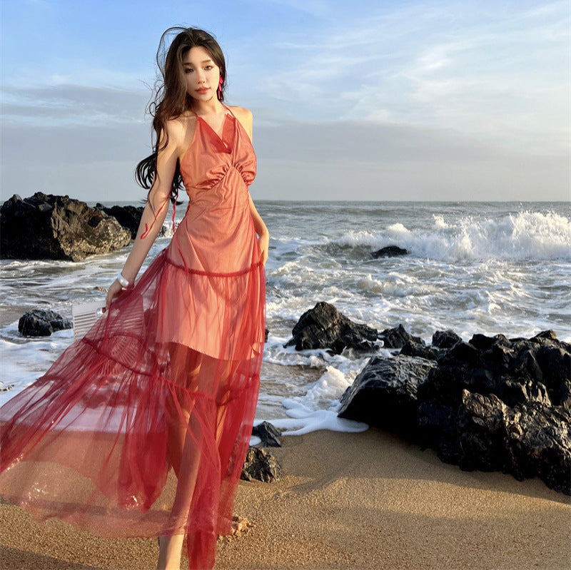 2025 Sanya seaside vacation dress women's design sense niche red backless mesh splicing suspender neck long skirt
