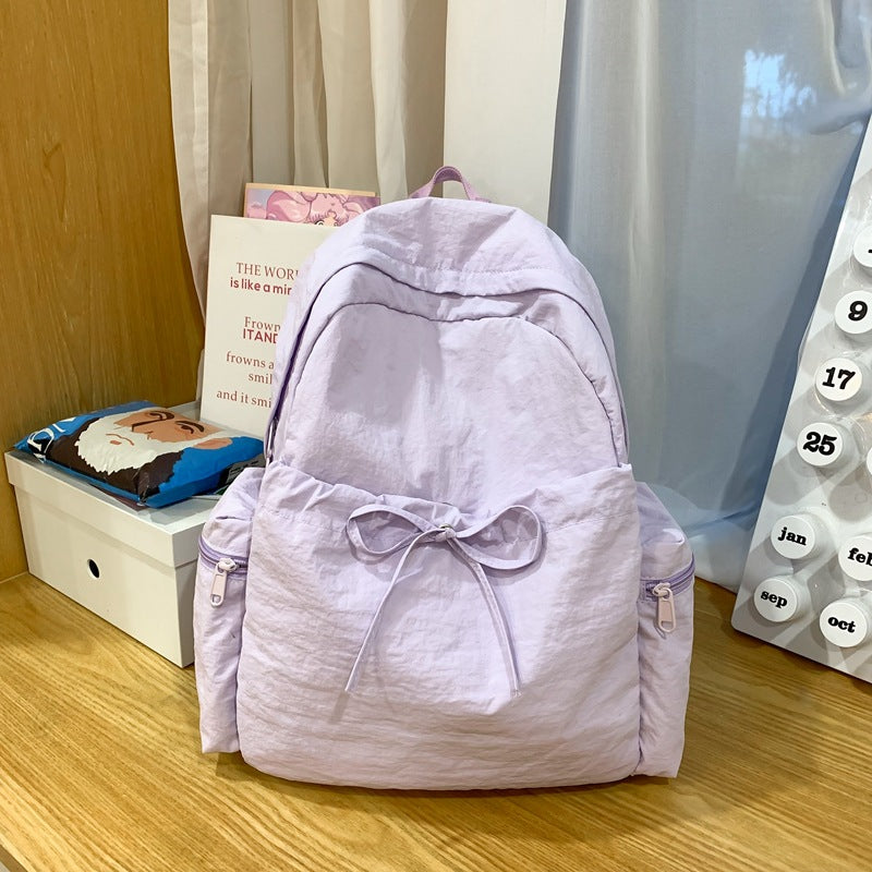 2025 School bag female college student cute bow simple junior high school student backpack female high school student large capacity backpack casual