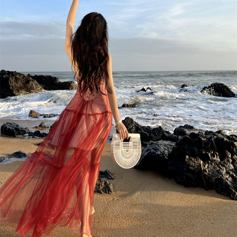 2025 Sanya seaside vacation dress women's design sense niche red backless mesh splicing suspender neck long skirt