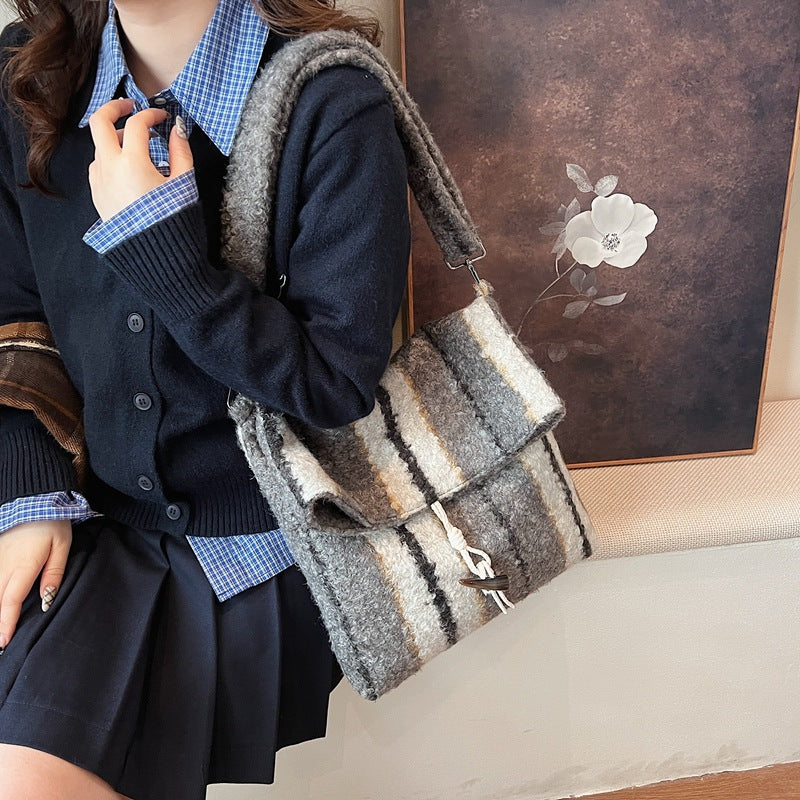 FLOWERSVERSE 2025 popular autumn and winter new striped woolen shoulder bag fashion lamb wool folding horn buckle Korean version fashion messenger bag
