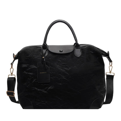 2025 New large-capacity portable travel bag, women's light sports fitness bag, outdoor leisure travel bag, duffel bag.