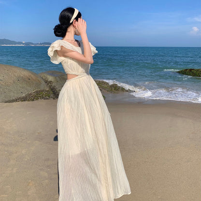 2025 Niche design sense hollow waist seaside vacation flying sleeve dress women's summer Sanya travel photo dress