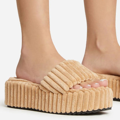 flowersverse Wearing Plush Slippers With A Large Thick Sole On The Outside