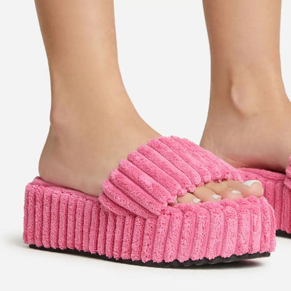 flowersverse Wearing Plush Slippers With A Large Thick Sole On The Outside