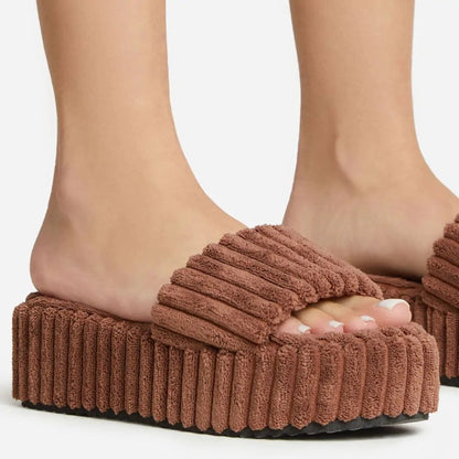 flowersverse Wearing Plush Slippers With A Large Thick Sole On The Outside